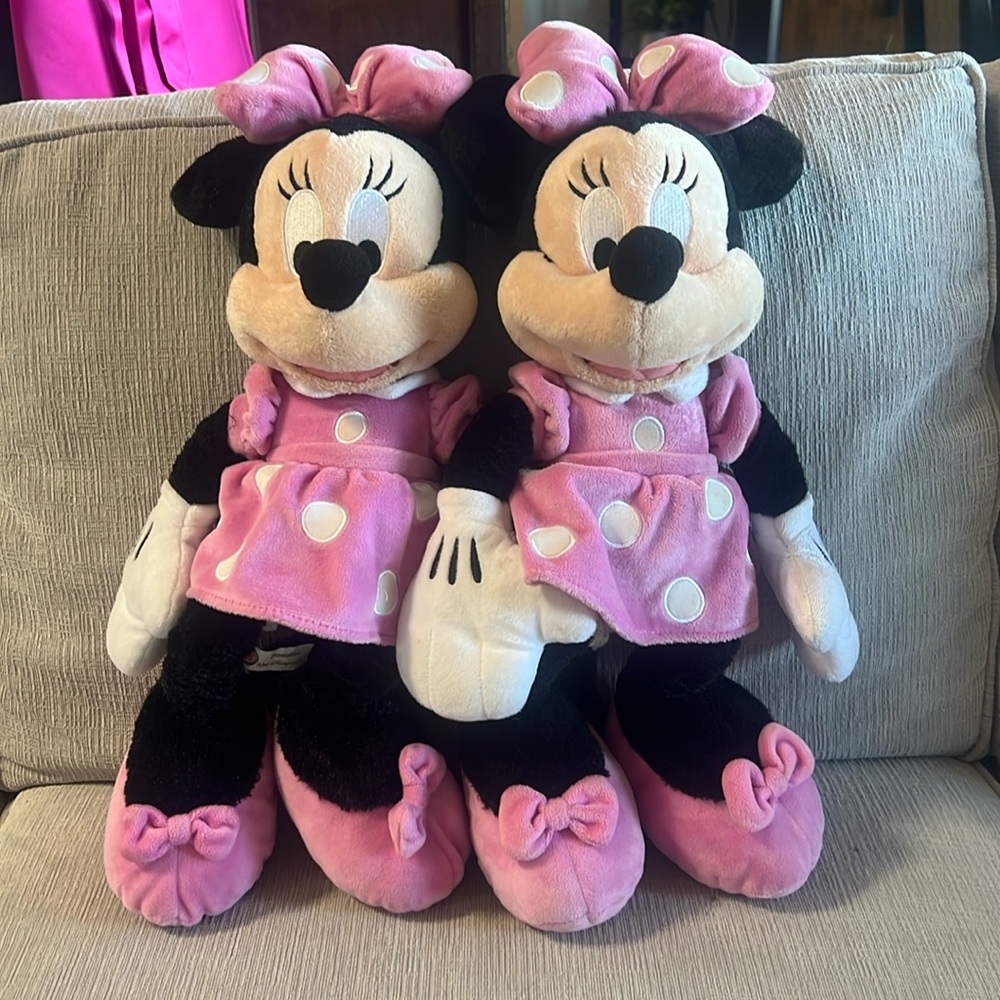 Twin Minnie Mouse plushes